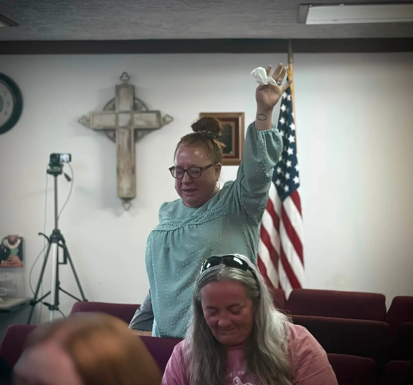 A worshipper praying during a church service